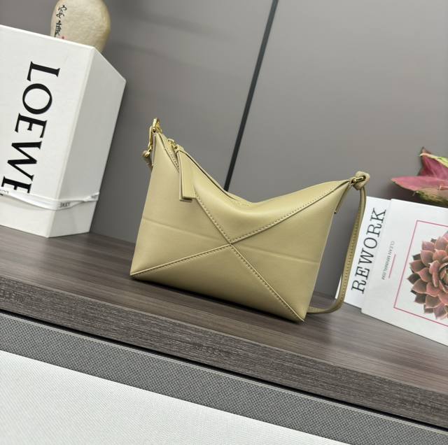 Lw's new Puzzle Fold Pouch handbag reinterprets the practical and versatile clut