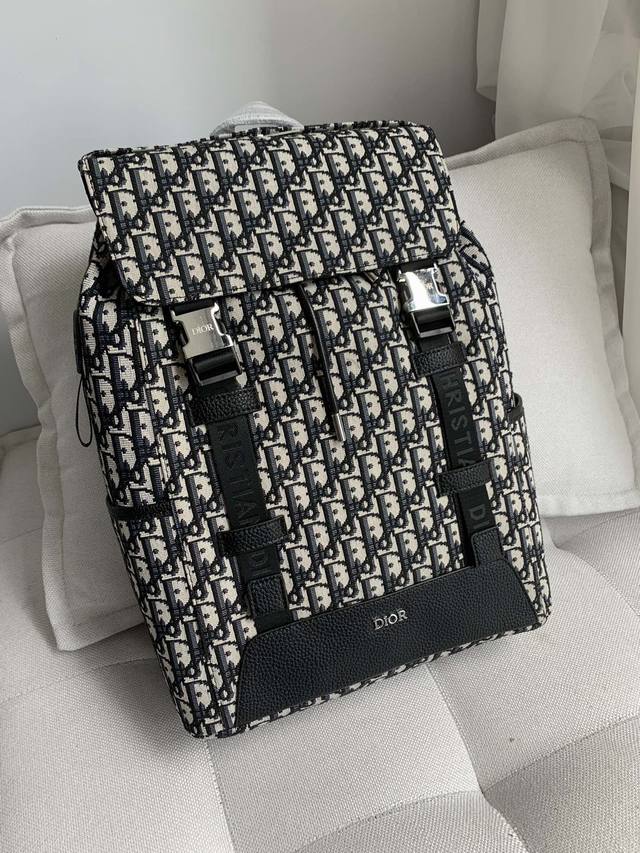 Dior Dior New Oblique Print Canvas Backpack Available Now! This backpack is incr