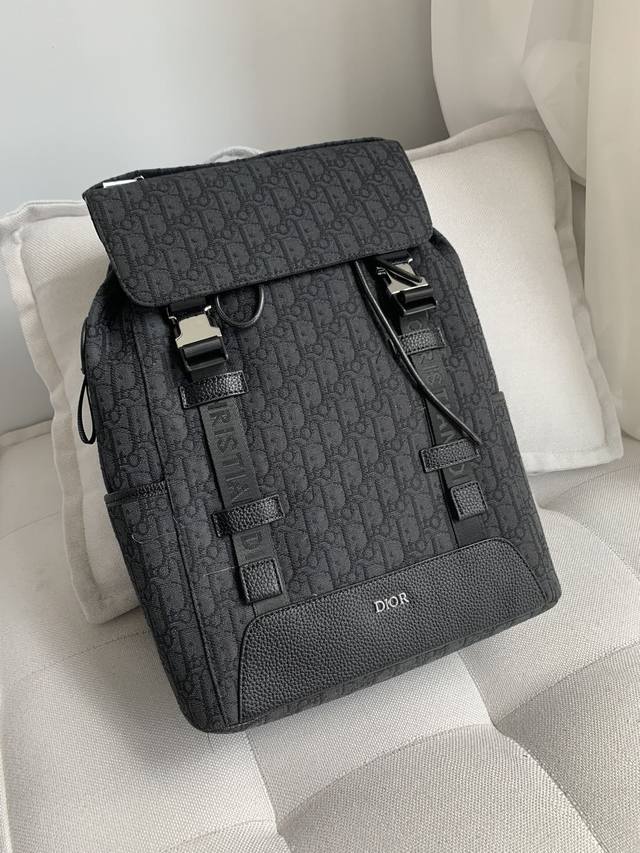 Dior Dior New Oblique Print Canvas Backpack Available Now! This backpack is incr
