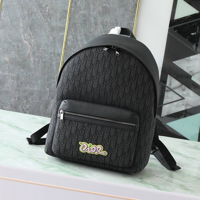 Rider 2.0 zip-up backpack is from the Dior And Kaws limited edition collection.