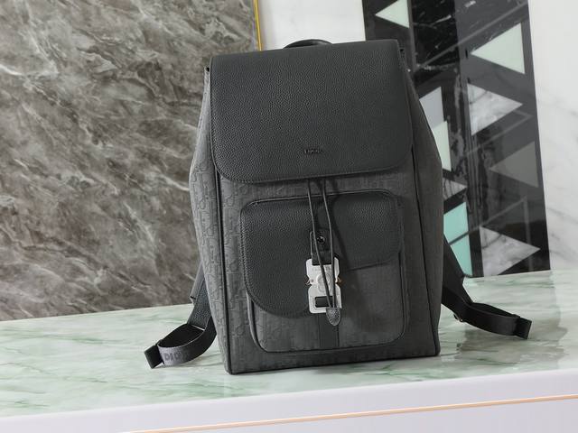 This saddle flap backpack features a stylish, original design that highlights th