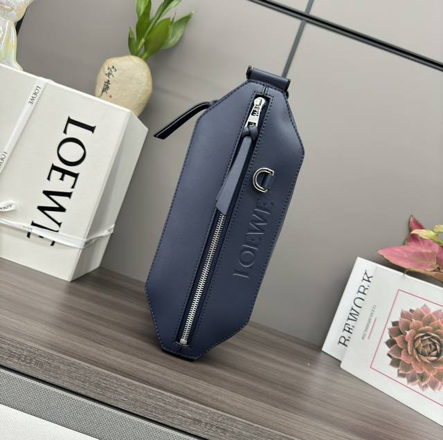 Low Classic Calfskin Leather Transformed Sling Handbag. This compact Sling handb