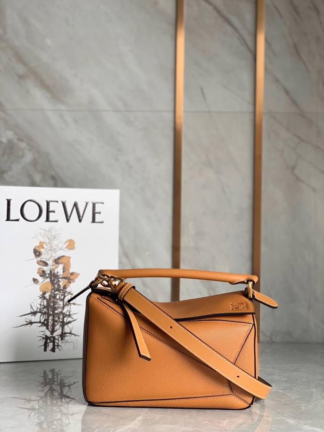 Lo*We's popular Puzzle bag is made of imported pique calfskin with a unique cut