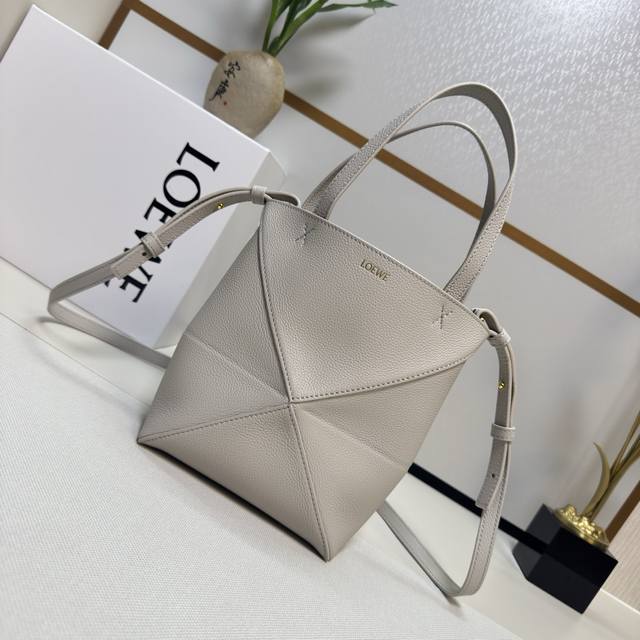 The new Loewe mini grained calfskin Puzzle Fold handbag draws inspiration from t
