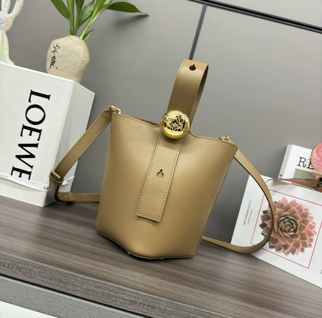 The Lwmini Pebble Bucket bag in soft cowhide leather cleverly blends clean, mini