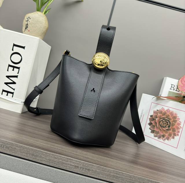 The Lwmini Pebble Bucket bag in soft calfskin leather cleverly blends clean, min