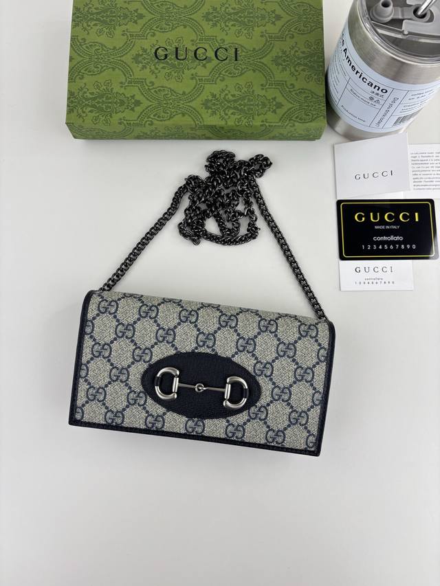 Gucci introduces its new 1955 Horsebit cardholder, crafted from Gg Supreme canva