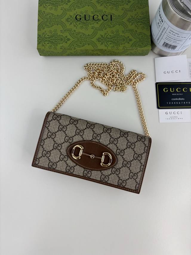 Gucci introduces its new 1955 Horsebit cardholder, crafted from Gg Supreme canva