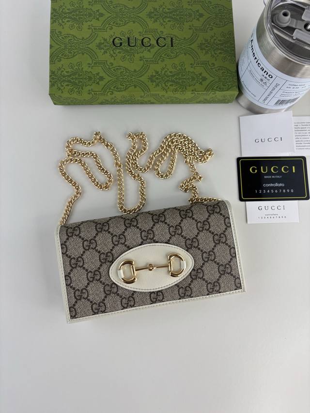 Gucci introduces its new 1955 Horsebit cardholder, crafted from Gg Supreme canva