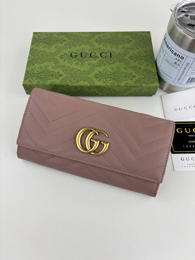 Guccl Gg Marmont Long Wallet crafted from quilted leather with an embroidered Gg