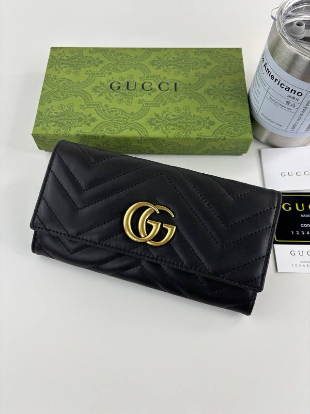 Guccl Gg Marmont Long Wallet crafted from quilted leather with an embroidered Gg