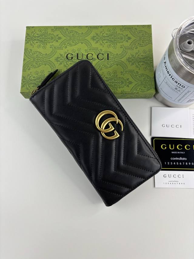 Guccl Gg Marmont Long Zip Wallet. Features quilted construction, embroidered Gg