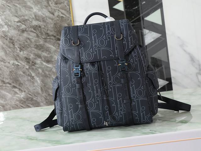 This Dior Hit The Road flap backpack seamlessly blends modern style with Dior's
