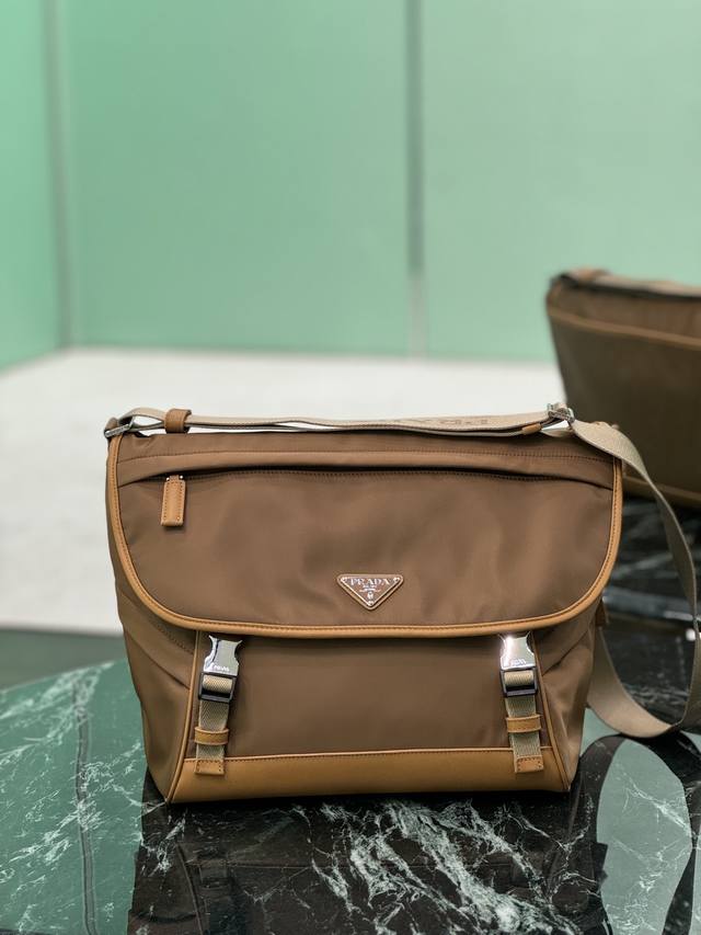 New Messenger Bag This messenger bag is designed with Re-Nylon recycled nylon fa