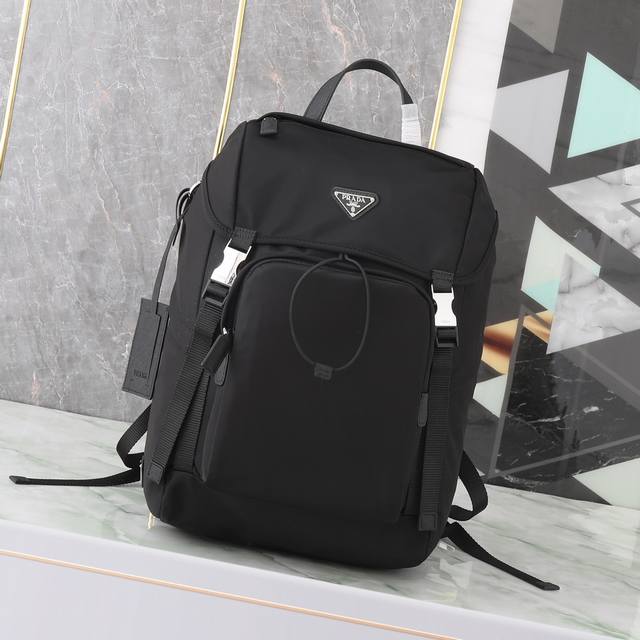 Exclusive First Look: 2Vz135 Backpack. This nylon backpack features Saffiano lea