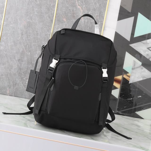 Exclusive First Look: 2Vz135 Backpack. This nylon backpack features Saffiano lea