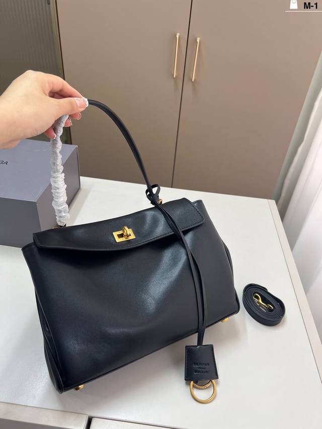 Balenciaga Rodeo Tote Bag. Although it has two buttons, I suggest you fasten the