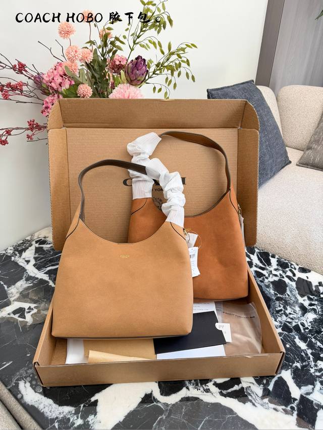 Coach Brooklyn Suede Handbag. Made of warm brown suede, this Coach Brooklyn hand