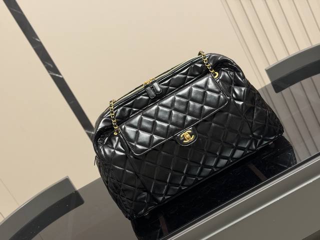 Chanel 24A Bowling Maxi Bag. This Chanel Maxi bowling bag exudes irresistible st