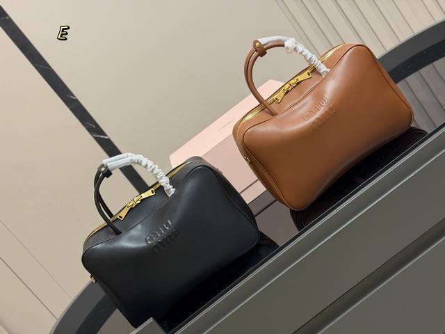 Comes with box. Size: 34*23cm. This Miumiu bowling briefcase is made of smooth,