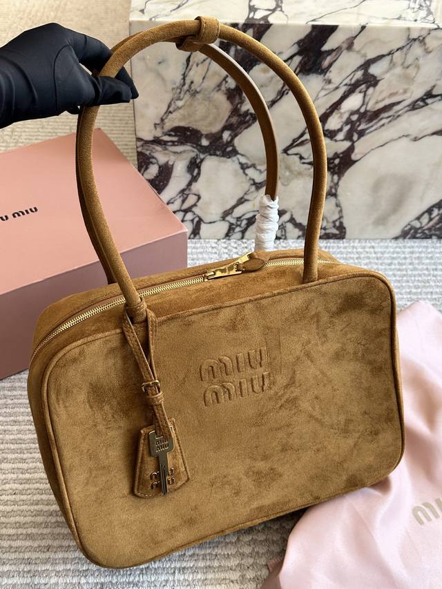 Comes with box. Size: 35*22cm. This Miumiu bowling briefcase is made of smooth,