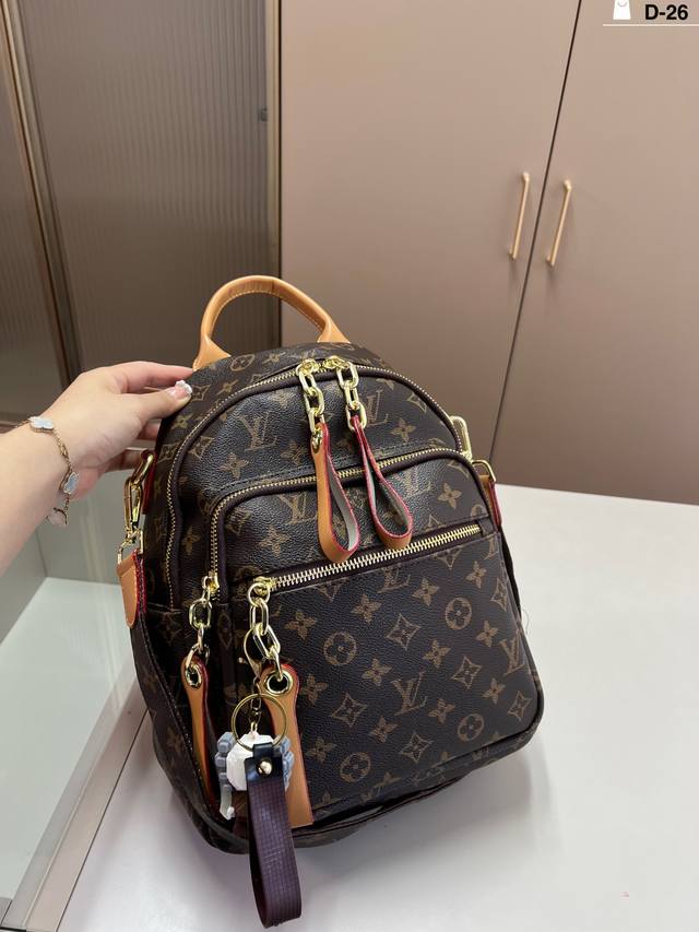 LV backpack, incredibly versatile, spacious and stylish. Size D-26: 24 x 30 cm.