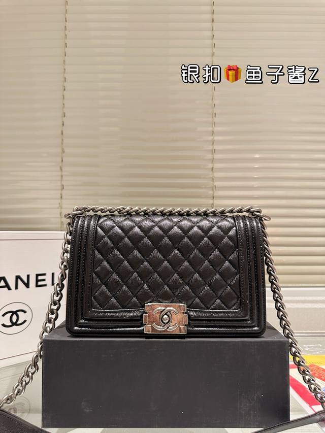 Replica Caviar Chanel Le Boy Mom Bag. A classic Chanel Le Boy bag, embodying hig