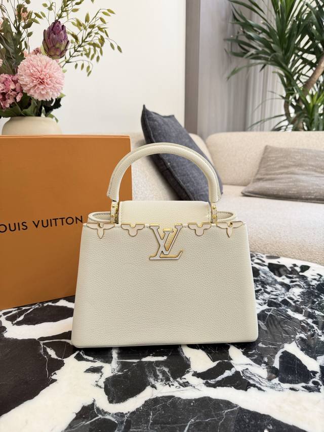 LV Capucines Handbag. This LV Capucines handbag is made of black Taurillon leath