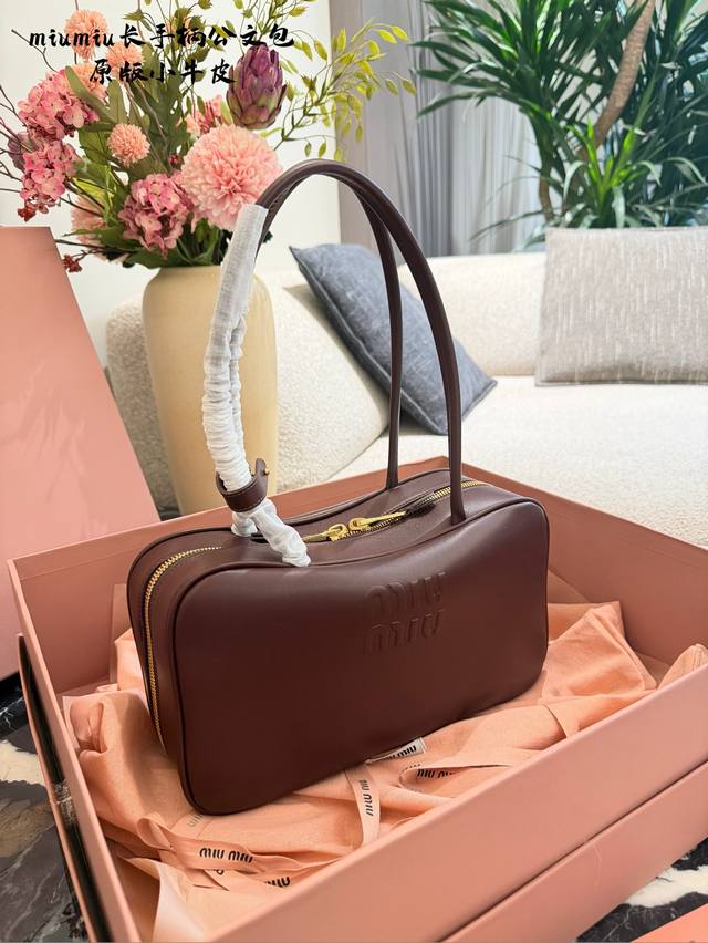 Original Leather Miumiu Cognac Long Handle Briefcase. Made of high-quality calfs