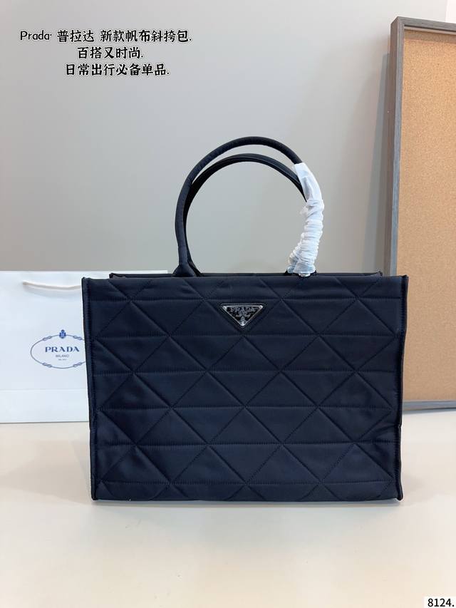 Prada Tote Bag Effortlessly embodies retro chic The bag has a structured shape,