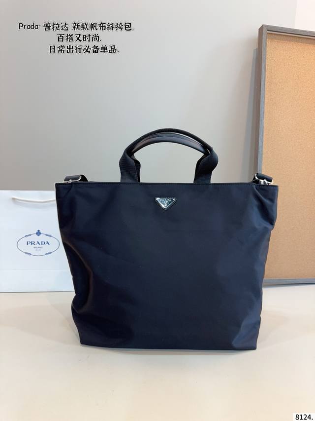 Prada Tote Bag Effortlessly embodies retro chic The bag has a structured shape,