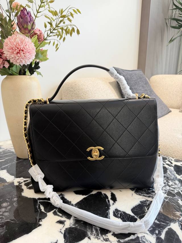 Chanel 25S Large Briefcase with a strong retro feel Chanel Black and Gold Flap B