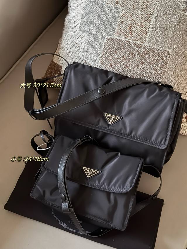 Prad messenger bag with folding box. Super spacious, unisex design. Simply put,