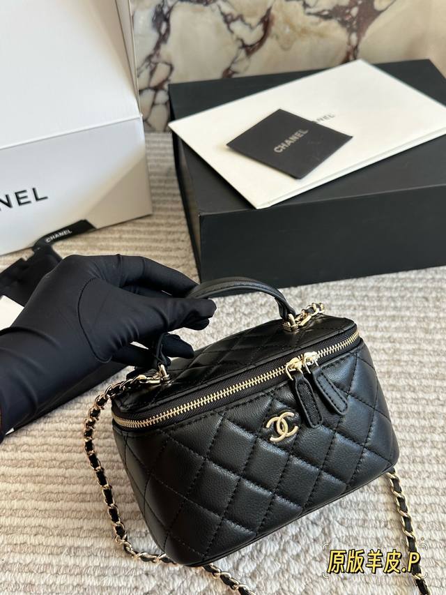 Lambskin Chanel Classic Handle Box Bag A timeless "handle box bag" that's incred