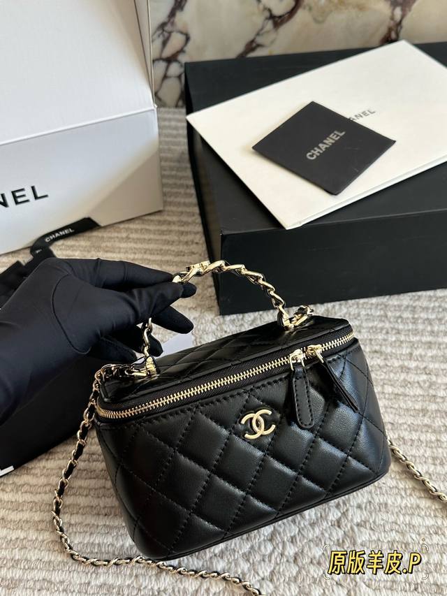 Lambskin Chanel Classic Handle Box Bag A timeless "handle box bag" that's incred