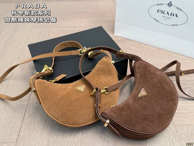 Double shoulder strap Prada underarm bag. Prada always by your side. Full of a u