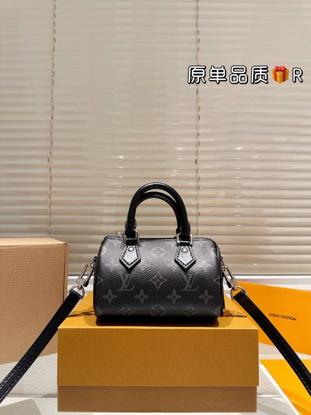 The LV Nano Speedy black monogram handbag features Monogram Eclipse coated canva