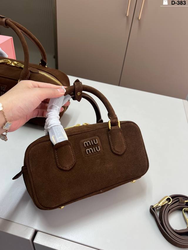 Small Miumiu deer antler bowling bag. Can be carried by hand or worn crossbody.