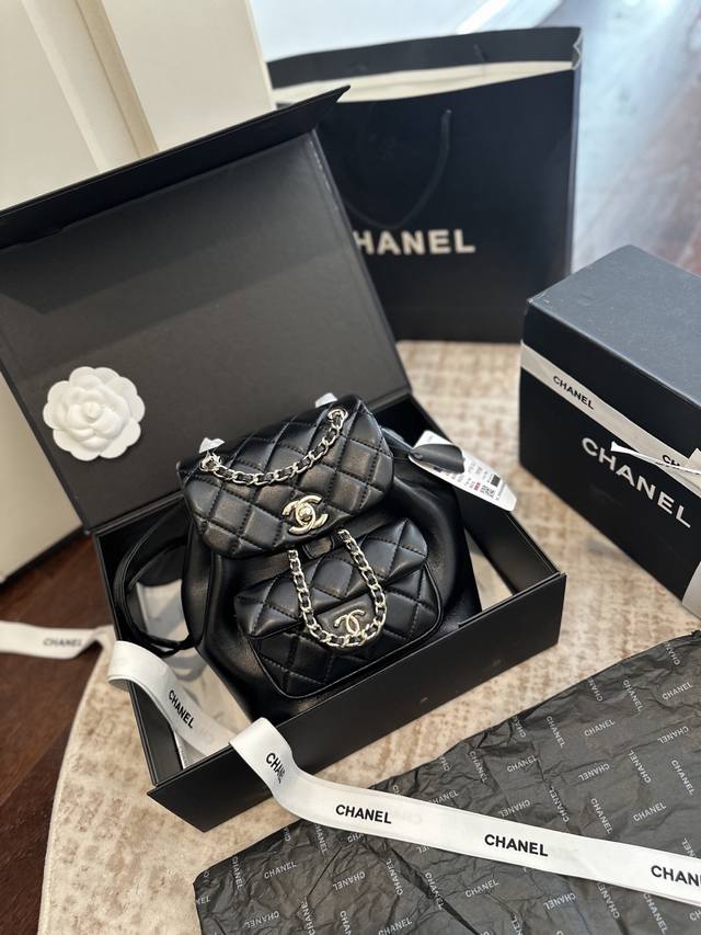 Cowhide leather Chanel 25P Duma backpack in folding gift box packaging. Features
