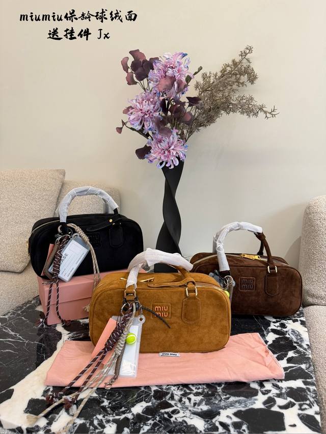 Miumiu Bowling Retro Bag: This brown bowling bag is bursting with retro charm! M