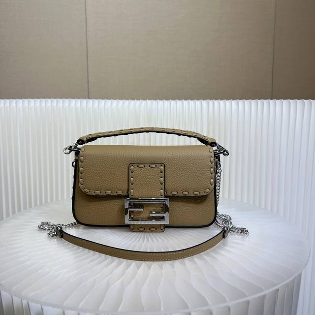 Authentic The iconic Baguette mini handbag, hand-stitched with 309 stitches in a