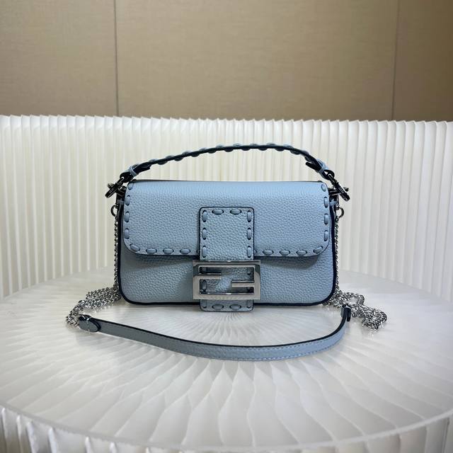 Authentic The iconic Baguette mini handbag, hand-stitched with 309 stitches in a