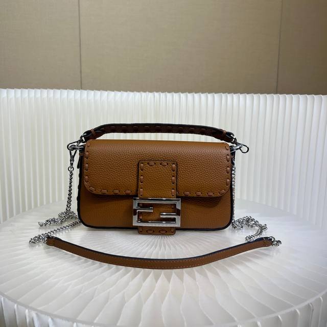 Authentic The iconic Baguette mini handbag, hand-stitched with 309 stitches in a