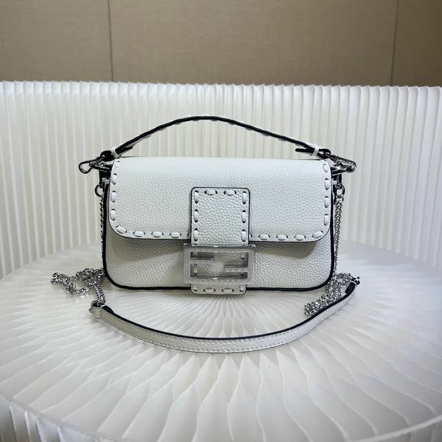 Authentic The iconic Baguette mini handbag, hand-stitched with 309 stitches in a