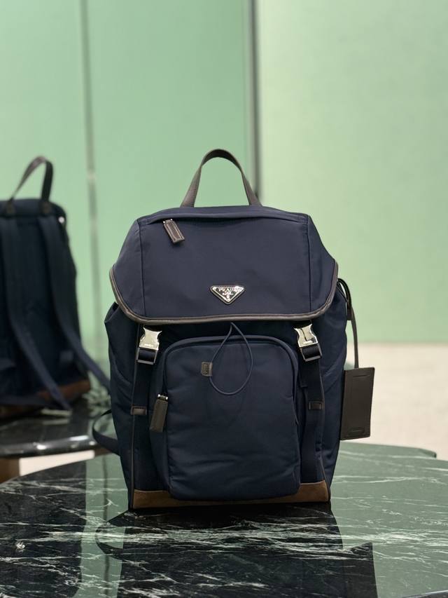 Authentic New Backpack This nylon backpack features contrasting suede trim, crea