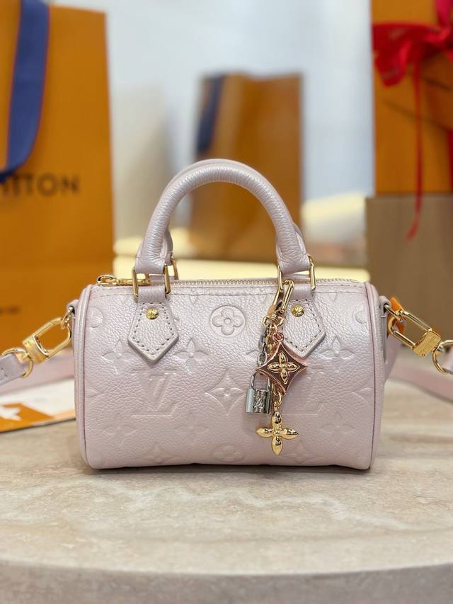 M27107 This Nano Speedy handbag is from the Monogram Empreinte Shimmery collecti