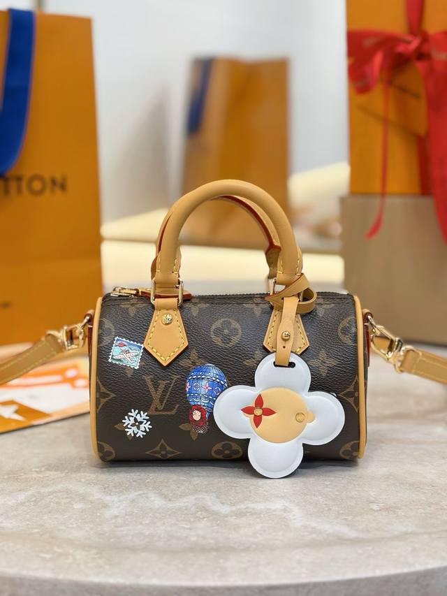 M15330 This Nano Speedy handbag features the brand's mascot, Vivienne, in playfu