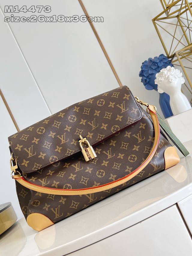 M14473 Hide Away handbag, crafted from Monogram coated canvas, seamlessly blends