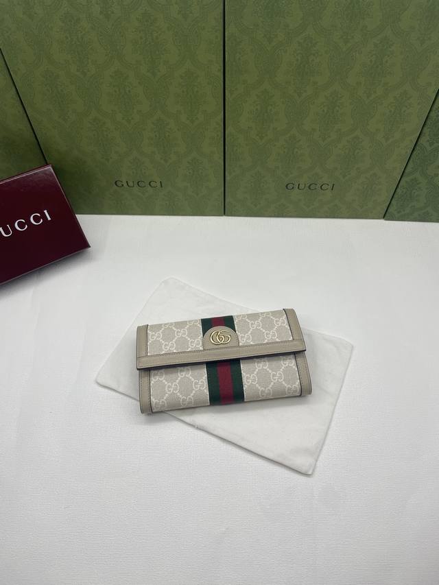 G's latest Ophidia series flap wallet with printed pattern is made of Gg Supreme