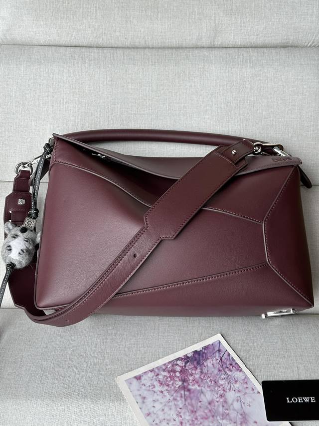 Original Leather Glossy Calfskin Puzzle Handbag 8503 The Puzzle handbag is the